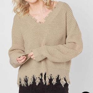 Tan buckle sweater off the shoulder